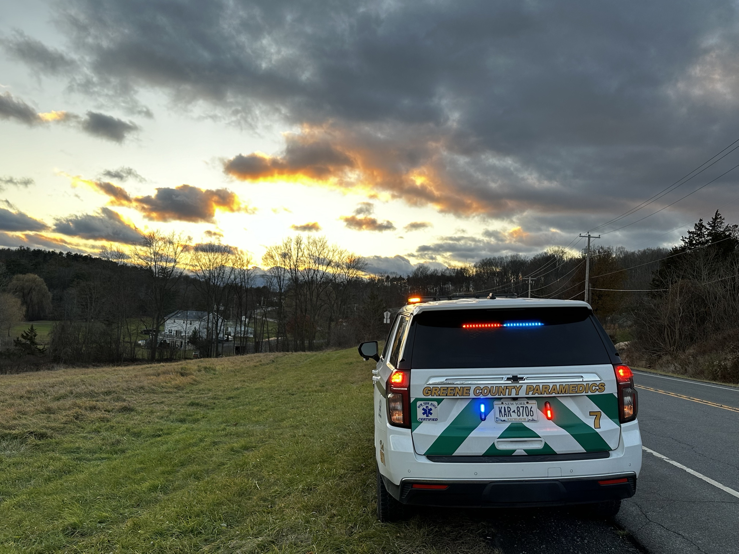 Medic 7 on a county road at sunset