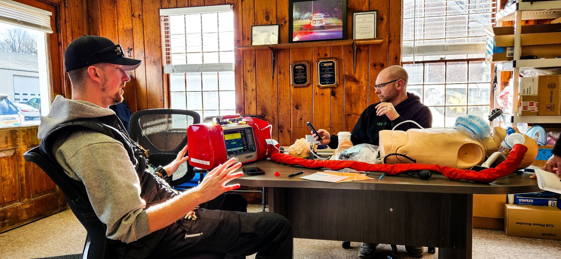 Chief of Operations Steve Near and the former Chief at the station, training with a Hamilton T1 ventilator and an airway mannequin