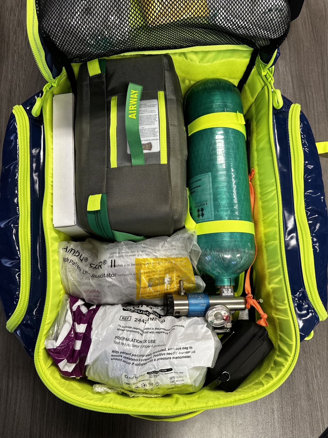 Inside a StatPacks bag: airway kit, oxygen cylinder, BVMs and regulator