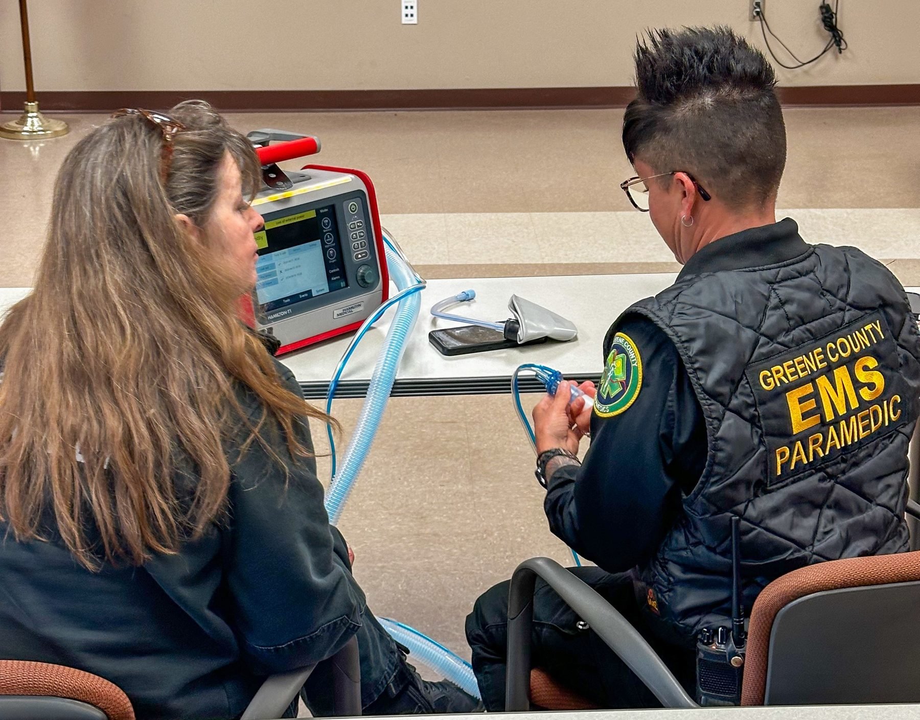 Two GCEMS paramedics working through T1 settings together
